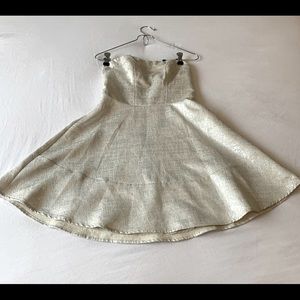 2 party dresses worn once.perfect condition. Turquoise:small silver dress:size 0